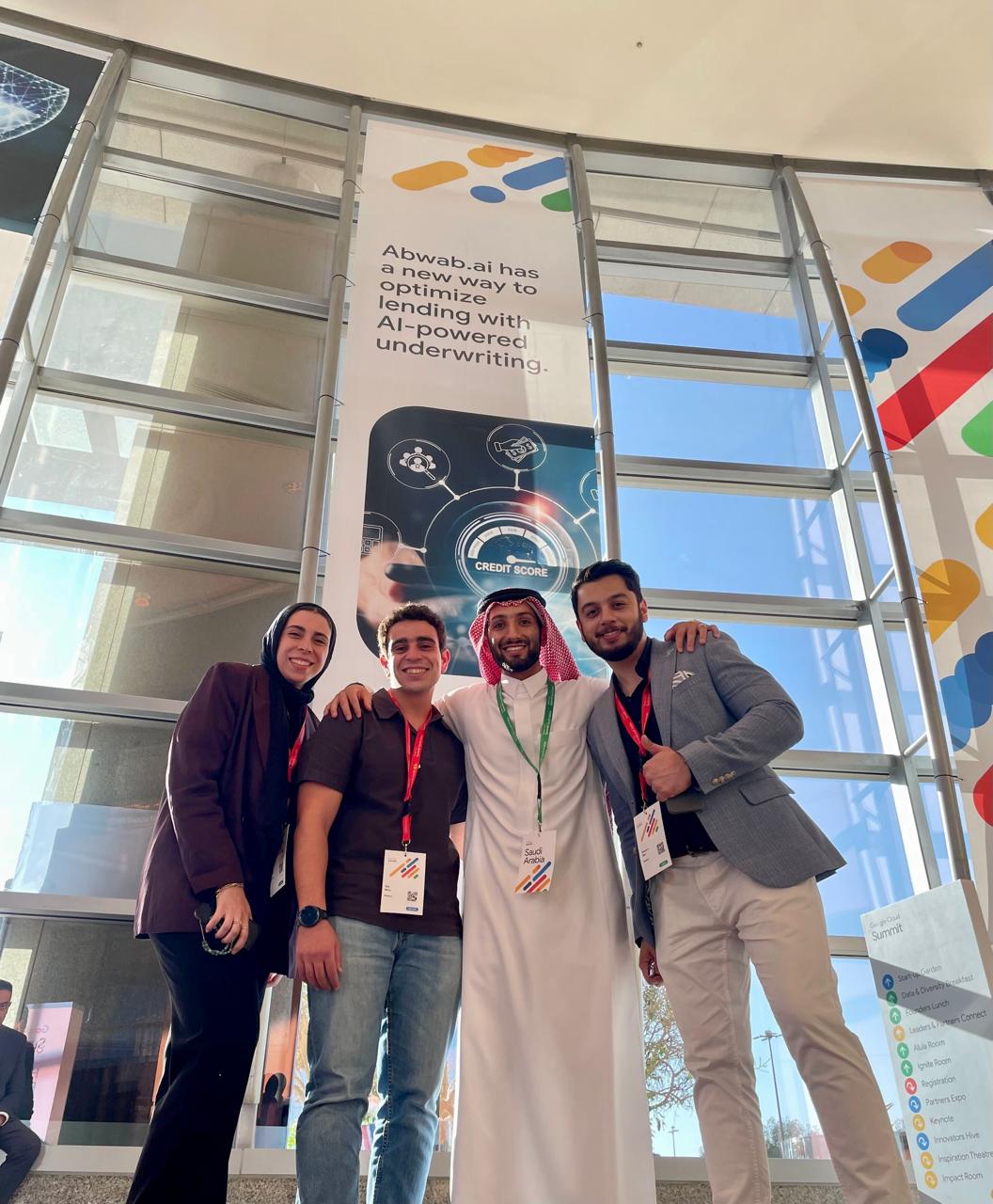 The Abwab.ai team in front of the AI-powered underwriting banner at Google Cloud Summit
